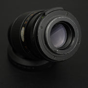 Chinon Auto Reflex 135mm f/2.8: teleobiettivo manuale M42 con ampia apertura f/2.8, ideale per ritratti e fotografia naturalistica. Immagini nitide e bokeh morbido.