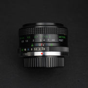 Vivitar MC 28mm f/2.8: obiettivo manuale compatto con trattamento MC, ideale per paesaggi e street photography, prestazioni eccellenti e design vintage.