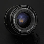 Vivitar MC 28mm f/2.8: obiettivo manuale compatto con trattamento MC, ideale per paesaggi e street photography, prestazioni eccellenti e design vintage.
